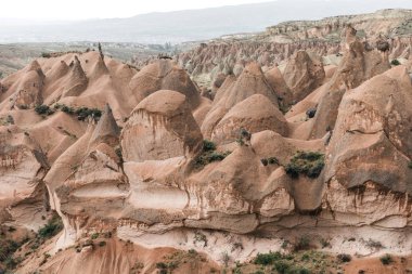 aerial view of beautiful bizarre rock formations in cappadocia, turkey  clipart