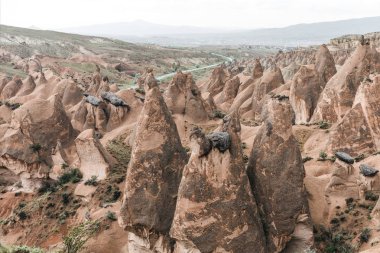 aerial view of scenic bizarre rock formations in cappadocia, turkey  clipart