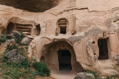 beautiful artificial caves in sandstone at famous cappadocia, turkey  clipart