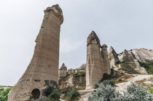 low angle view of bizarre rock formations in cappadocia, turkey