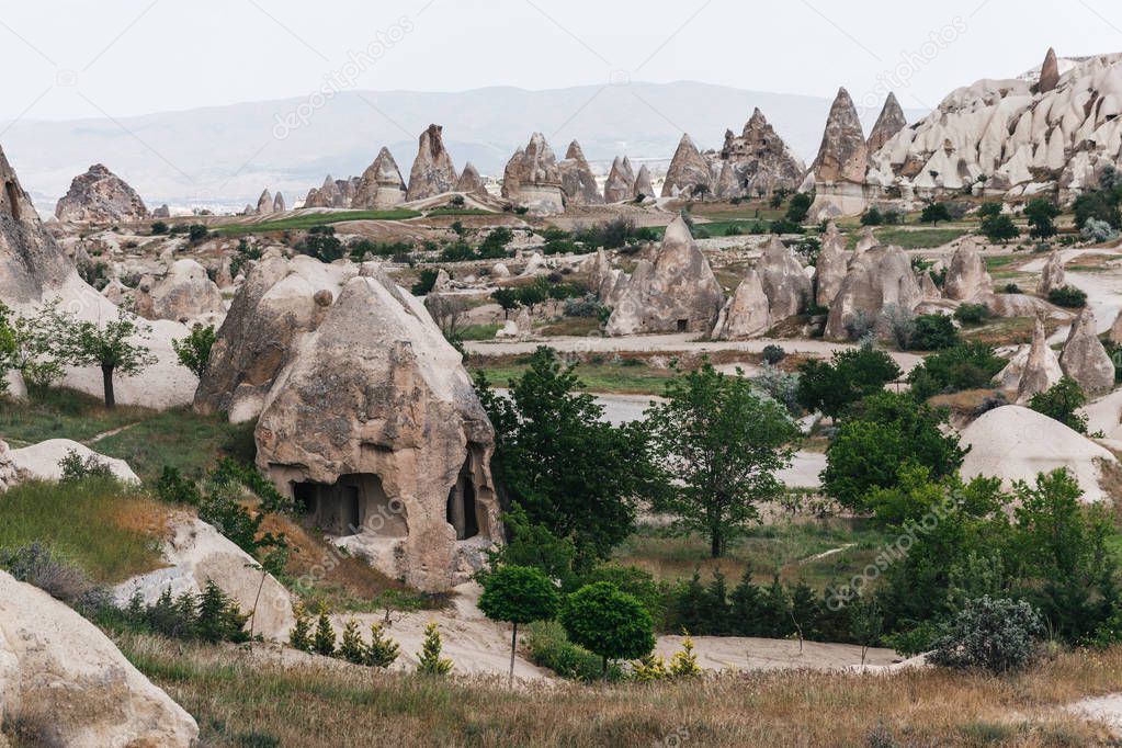 scenic tranquil view of famous rock formations and caves in cappadocia, turkey 