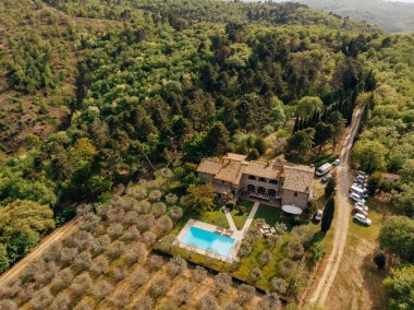 aerial view of villa with swimming pool near forest in Italy  clipart