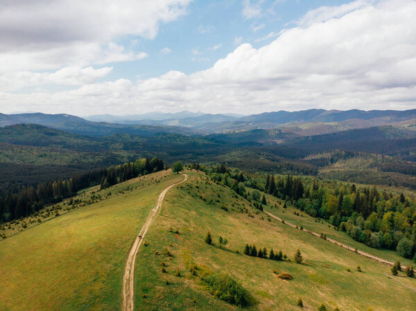 aerial view of green fields and mountains in arezzo province, Italy