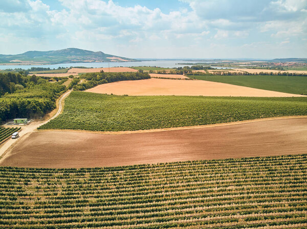 Aerial view of agricultural fields, river and mountains, Czech Republic