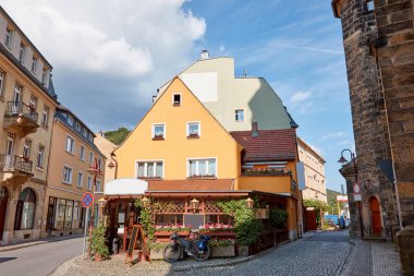 bicycle on street near building at sunny day in Bad Schandau, Germany clipart