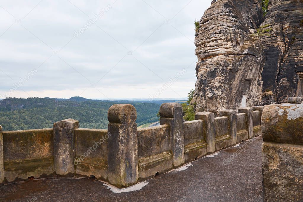 stone bridge, old rocks and forest in Bastei, Germany