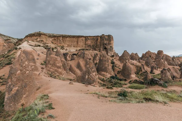 Beautiful eroded rock formations at cloudy day, cappadocia, turkey — Stock Photo