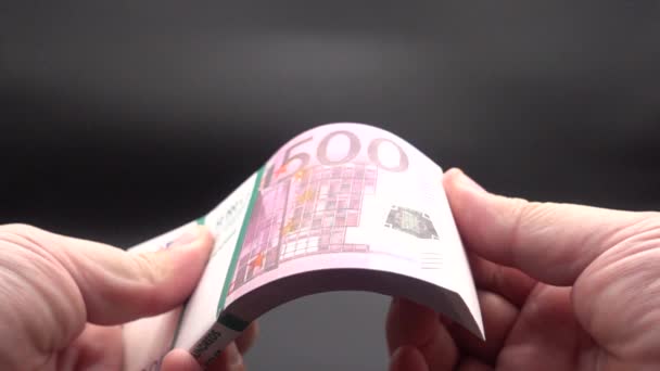 Leafing through a stack of banknotes — Stock Video