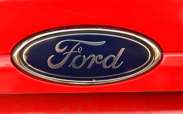 Turin, Piedmont region, Italy, July 2018. Close up of the Ford logo of a red 1.4 Gpl fiesta.