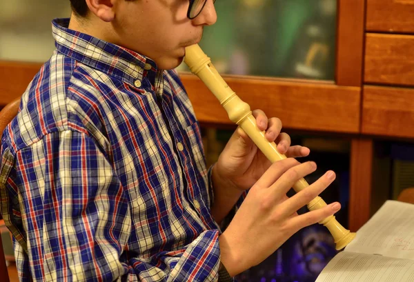 Practicing with the flute.