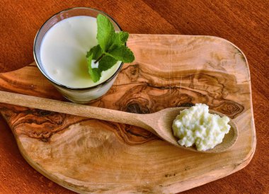 Kefir enriched with some mint leaves clipart