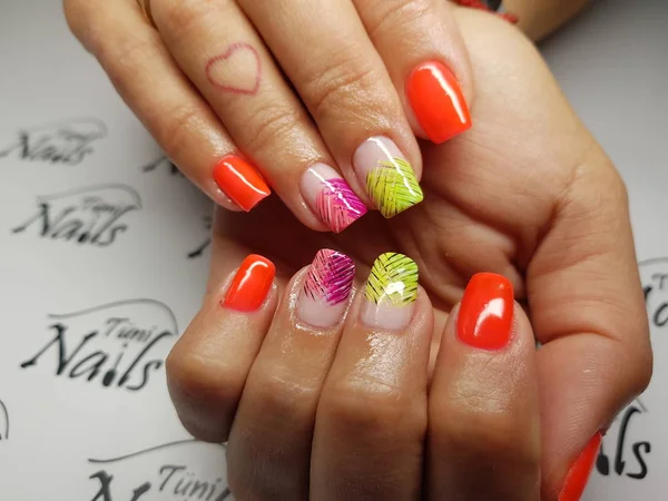 Beautiful colorful nails and hand manicure. — Stock Photo, Image