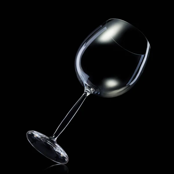 Empty glass for red wine isolated on black background. — Stock Photo, Image