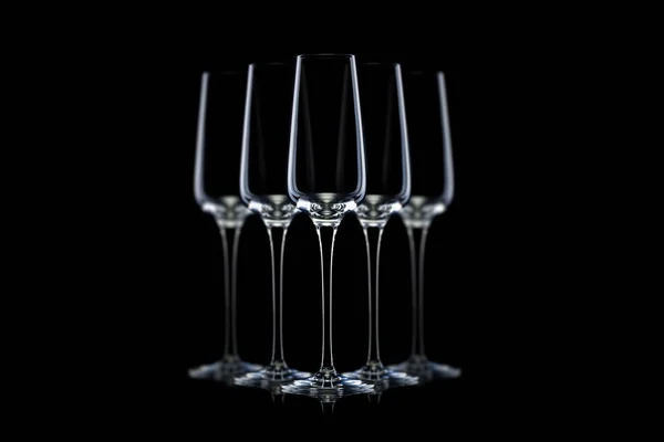 Set of empty luxury champagne glasses in a row isolated on a black background — Stock Photo, Image