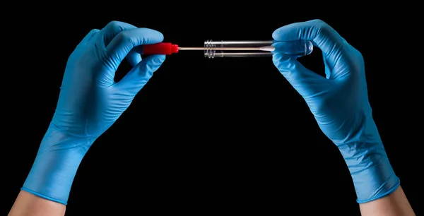 Doctors hands in medical gloves holding test tube with coronavirus COVID-19 — Stock Photo, Image
