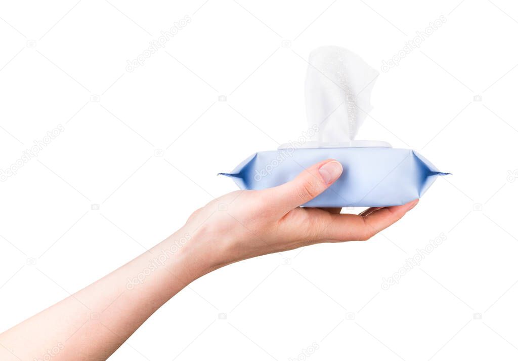 Woman hand holding package of wet wipes or tissue isolated on a white background