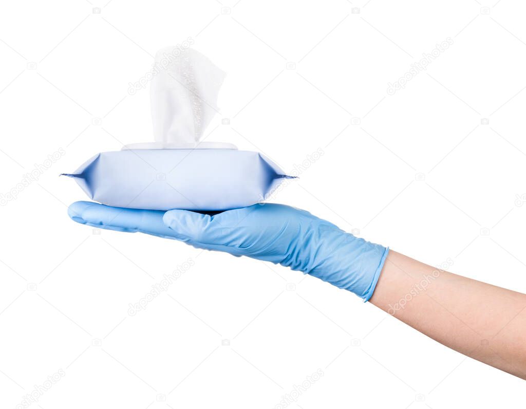 Woman hand in sterile gloves holding package of wet wipes or tissue