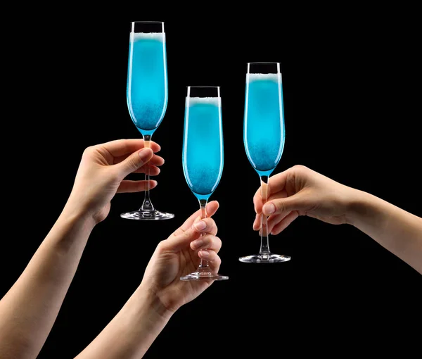 Set of hands holding glass of blue sparkling champagne isolated on black. — Stock Photo, Image