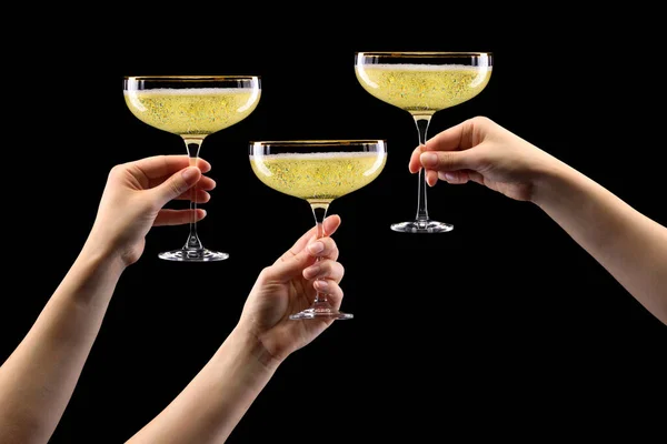 Set of hands holding glass of sparkling champagne isolated on black. — Stock Photo, Image