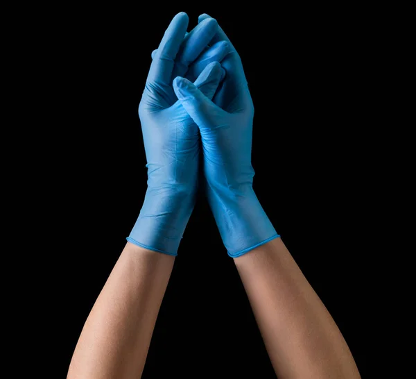 Artsen overhandigen steriele medische handschoenen die samen het geïsoleerde gebed symboliseren — Stockfoto