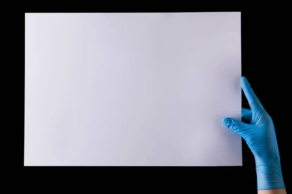 Doctor Hand Sterile Medical Gloves Holding Banner Isolated Black Background — Stock Photo, Image