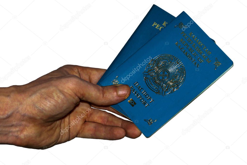 two passports of a citizen of the Republic of Kazakhstan in the hand of a person on a white background isolate