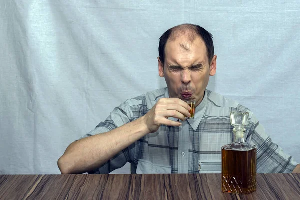 Man Sits Table Wants Drink Alcohol Same Time Wrinkled His — Stock Photo, Image