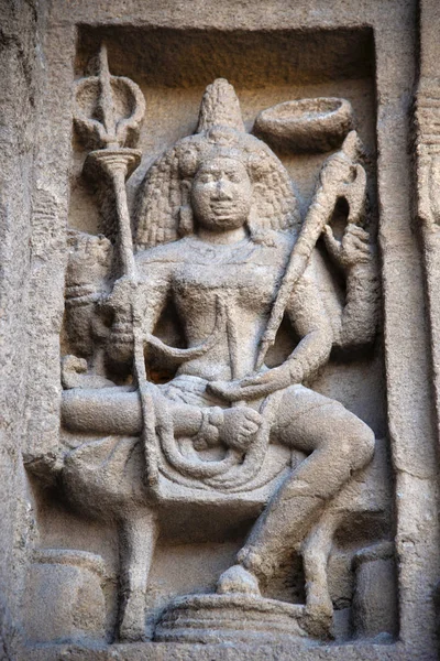 Carved idol on the inner wall of the Kanchi Kailasanathar temple, is the oldest structure, it is a Hindu temple in the Dravidian architectural style Kanchipuram, Tamil Nadu, India