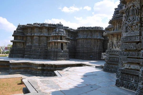 Facade and ornate wall panel relief of the west side, Hoysaleshwara temple, Halebidu, Karnataka, India. View from South.