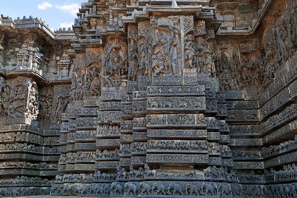 Facade and ornate wall panel relief of the west side, Hoysaleshwara temple, Halebidu, Karnataka, India. View from South.