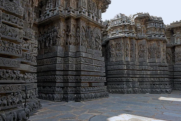 Facade and ornate wall panel relief of the west side, Hoysaleshwara temple, Halebidu, Karnataka, India. View from West.