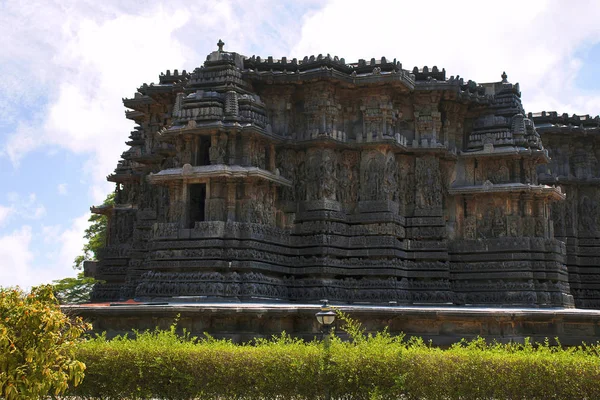 Facade and ornate wall panel relief of the west side, Hoysaleshwara temple, Halebidu, Karnataka, India. View from West.