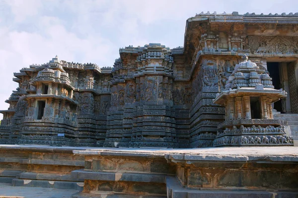 Facade and ornate wall panel relief, Hoysaleshwara temple, Halebidu, Karnataka, India. View from North