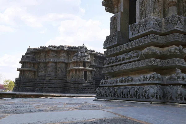 Facade and ornate wall panel relief, Hoysaleshwara temple, Halebidu, Karnataka, India. View from South