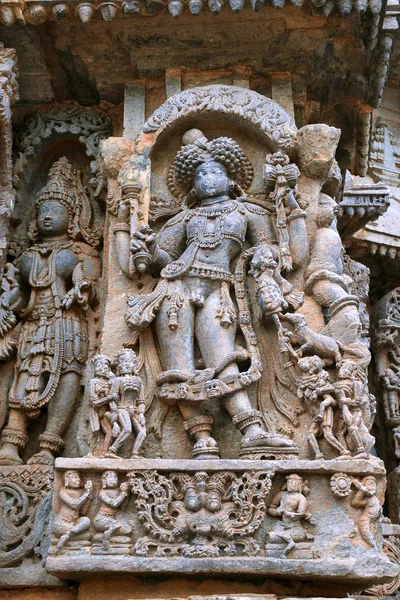 Ornate wall panel reliefs depicting Bhairava, a form of Shiva, Kedareshwara temple, Halebidu, Karnataka, India. — Stock Image Ornate Wall Panel Reliefs Depicting Bhairava Form Shiva Kedareshwara Temple Stock Image