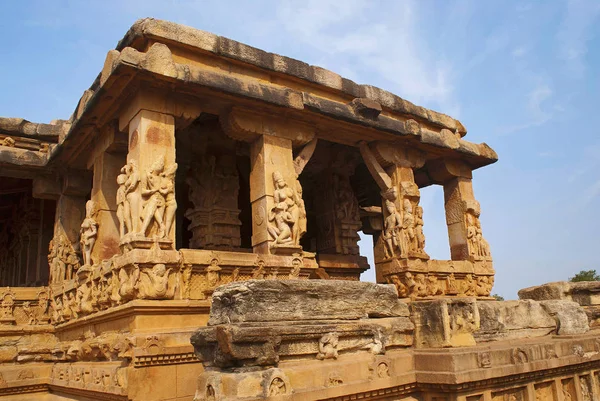 Entrance porch of Durga temple, Aihole, Bagalkot, Karnataka, India. The Galaganatha Group of temples. The sober and square pillars are decorated with characters around the porch and the entrance to the peristyle.
