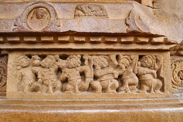 Figures of the shiva ganas servants of the lord Shiva carved on the plinth, Durga temple, Aihole, Bagalkot, Karnataka, India. The Galaganatha Group of temples.