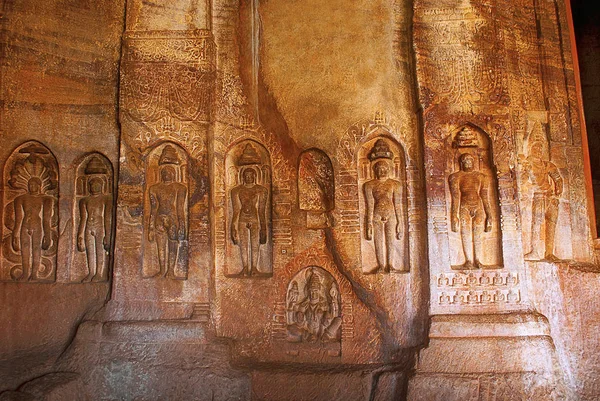Cave 4 : Jaina Tirthankara images engraved on the inner pillars and walls. There are idols of Yakshas, Yakshis, Padmavati and other Tirthankaras. Badami caves, Badami, Karnataka, India.