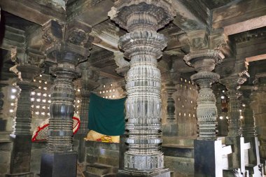 Windows and pillars, interior view of Chennakeshava shrine hall. Chennakeshava temple. Belur, Karnataka, India clipart