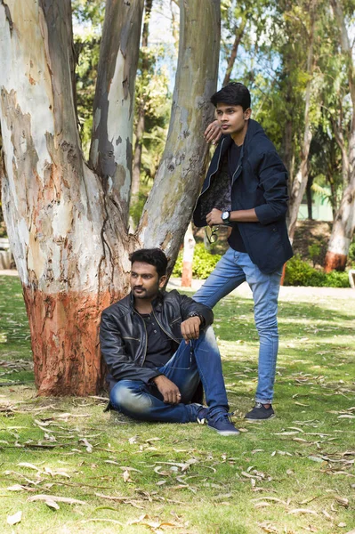 Two Young Men Casual Trendy Clothes Park Posing Camera — Stock Photo, Image