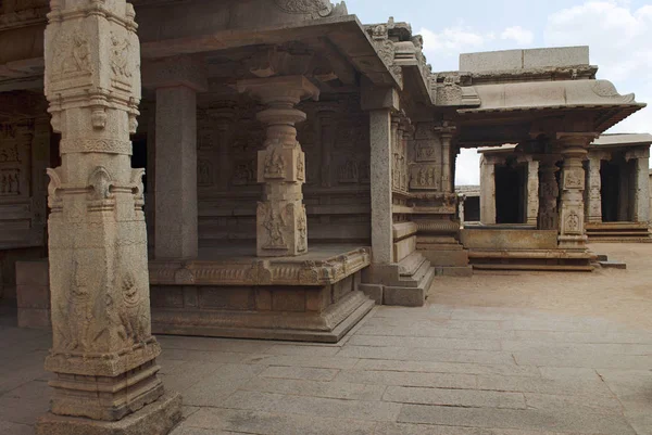 Finely carved columns of the entrance porch and side, north, porch of ardhamandapa on the right side. Hazara Rama Temple. Royal Center or Royal Enclosure. Hampi, Karnataka, India. View from the east.