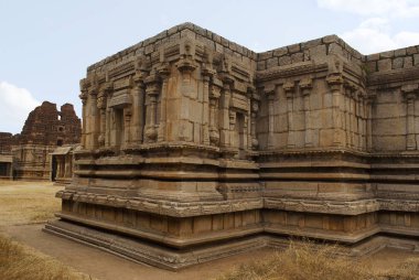 Twin chambered shrine of goddess, west side view, Achyuta Raya temple, Hampi, Karnataka, India. Sacred Center. The north gopura is ssen in the distance on the left. clipart