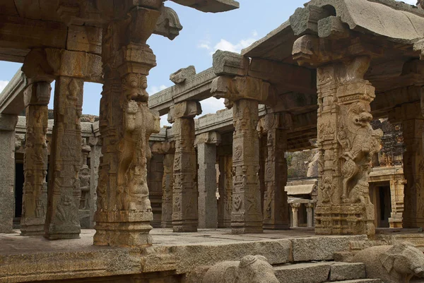 Carved pillars of at the entrance of the maha-mandapa, Achyuta Raya temple, Hampi, Karnataka, India. Sacred Center. View from north-east. Pillars spot lion faced rampant Yalis standing on elephants