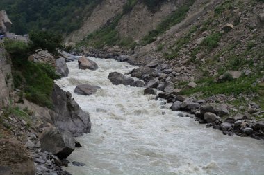 The Dhauliganga is one of the six source streams of the Ganges river. It meets the Alaknanda River at Vishnuprayag at the base of Joshimath mountain in Uttarakhand clipart