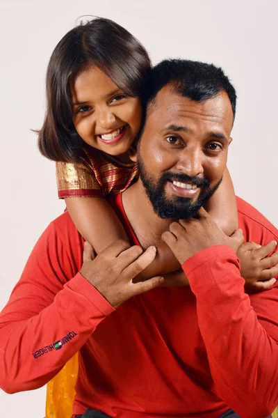 Little girl hugging her father and on his shoulders. Pune, Maharashtra — Stock Photo, Image