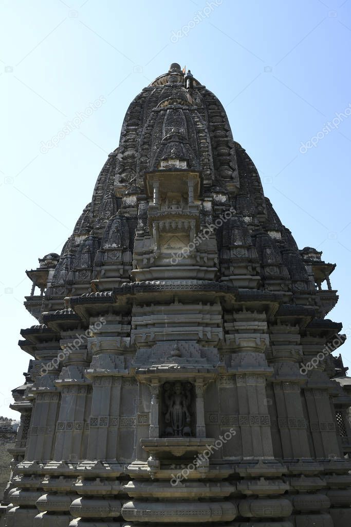 Stone masonry Shikhara with carvings of statue of Vishnu the God at Vitthal Temple, Palashi, Parner, Ahmednagar