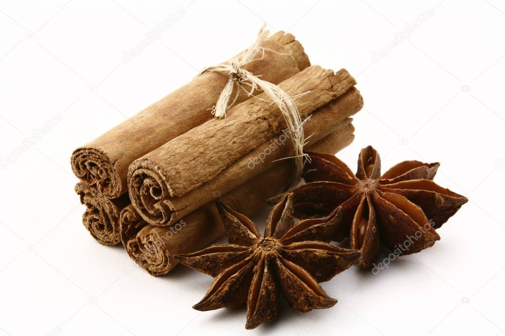 star anise and cinnamon on white background