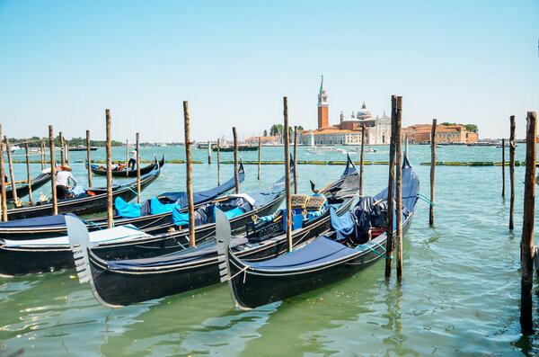 Gondolas in Venice.Beautiful view of traditional Gondola on Canal Grande with San Giorgio Maggiore church in the background, San Marco, Venice, Ital