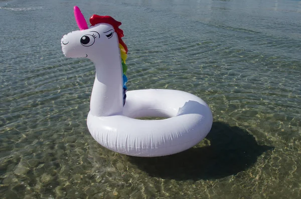 Unicorn pool ring, unicorn pool float on the sea. Unicorn swim t
