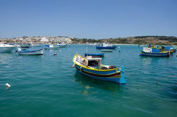 Colorful painted wood boats with the typical protective eyes on